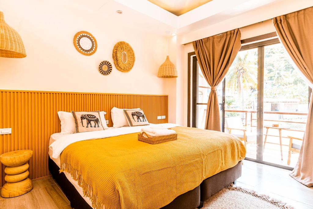 Postel nebo postele na pokoji v ubytování Molly Resorts