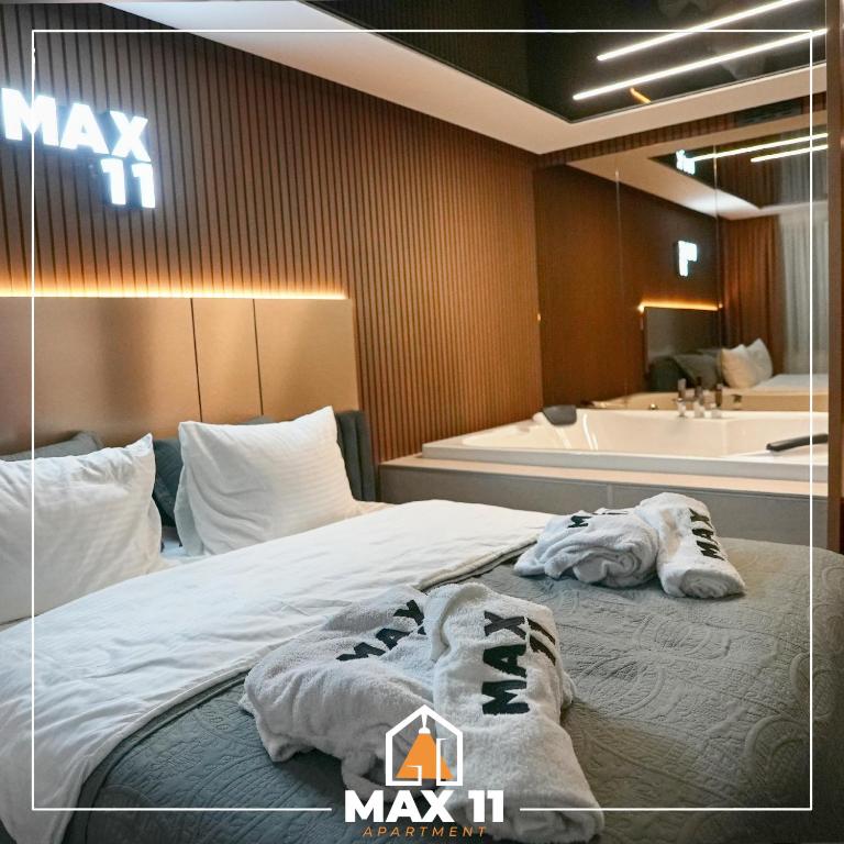 Postel nebo postele na pokoji v ubytování MAX 11 Apartman