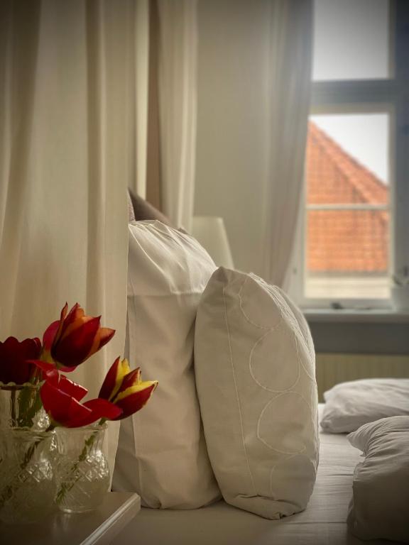 Postel nebo postele na pokoji v ubytování Brødremenighedens Hotel