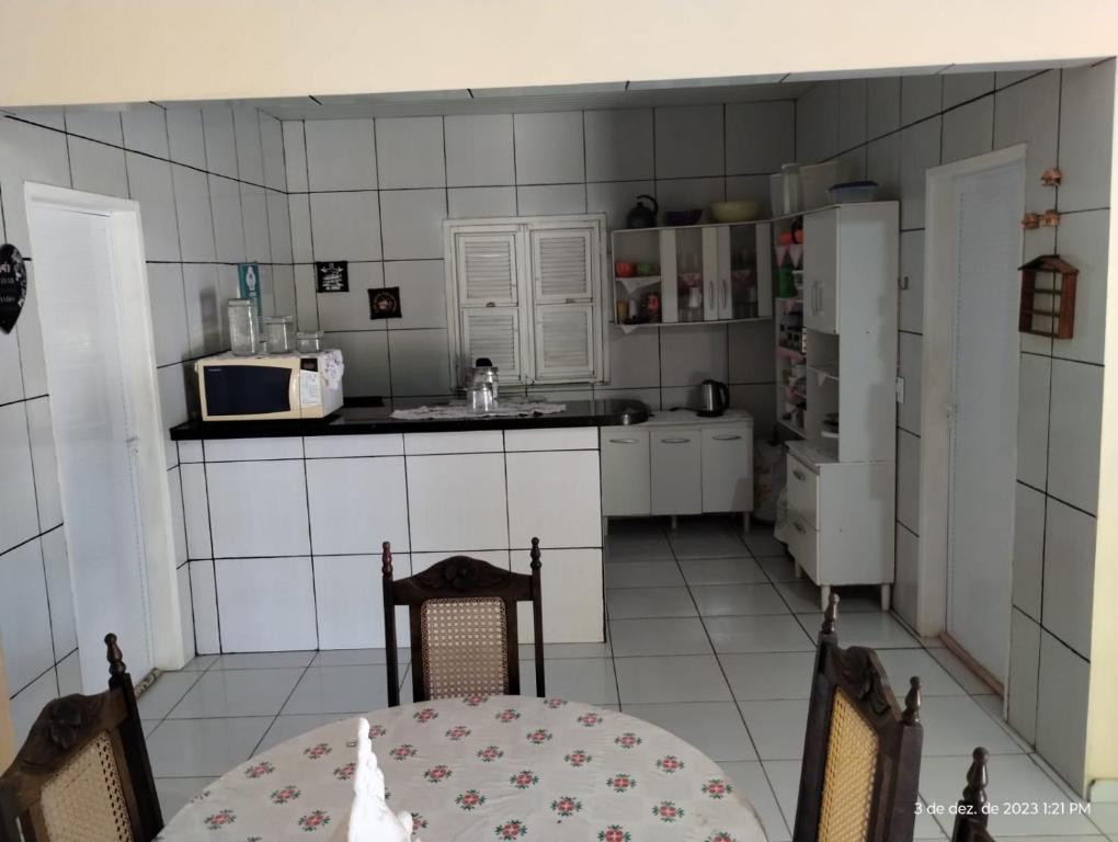 Kuchyň nebo kuchyňský kout v ubytování Aconchego do bens
