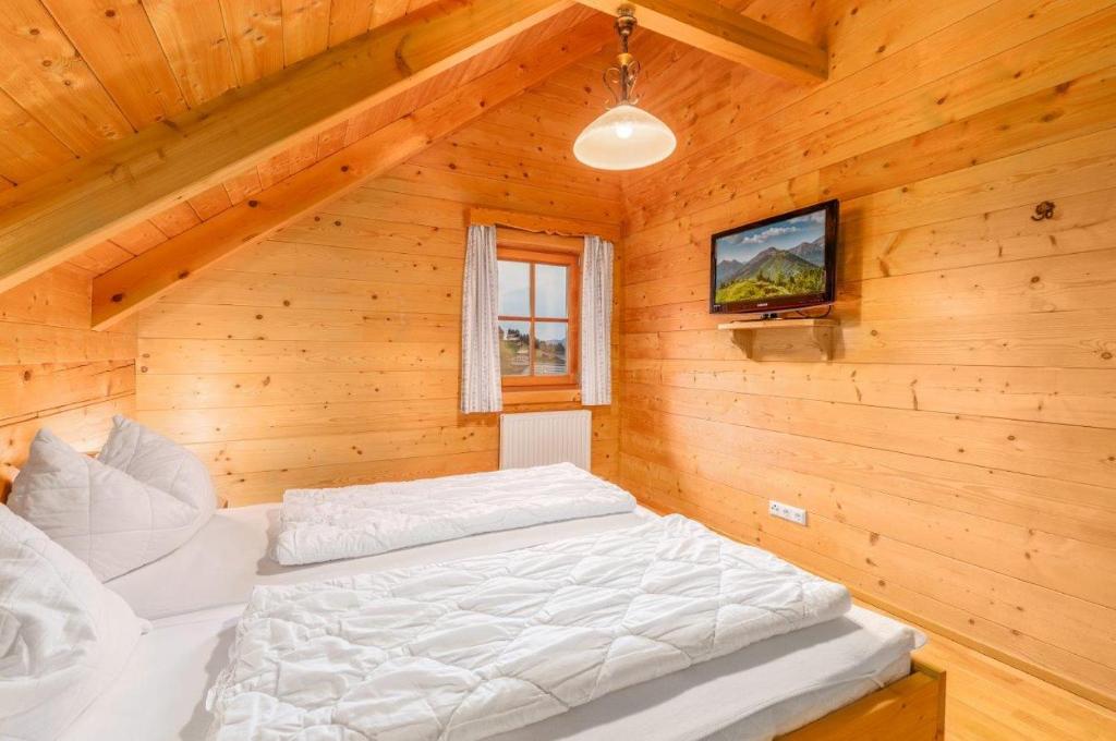 Postel nebo postele na pokoji v ubytování Chalet Dachsteinblick