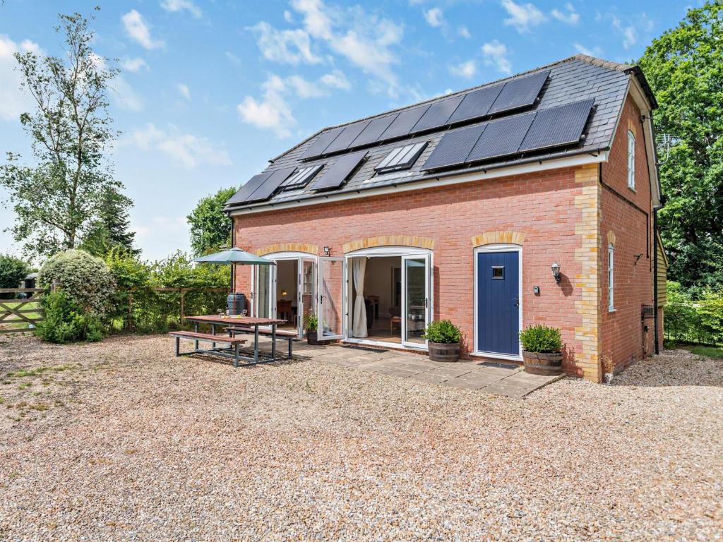 a barn with solar panels on the roof at 3 bed property in Sturminster Newton Dorset RCORN in Sturminster Newton