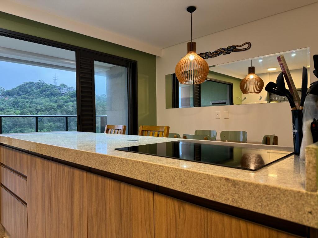 a kitchen with a sink and a counter top at OKA Praia Brava - Norte in Itajaí