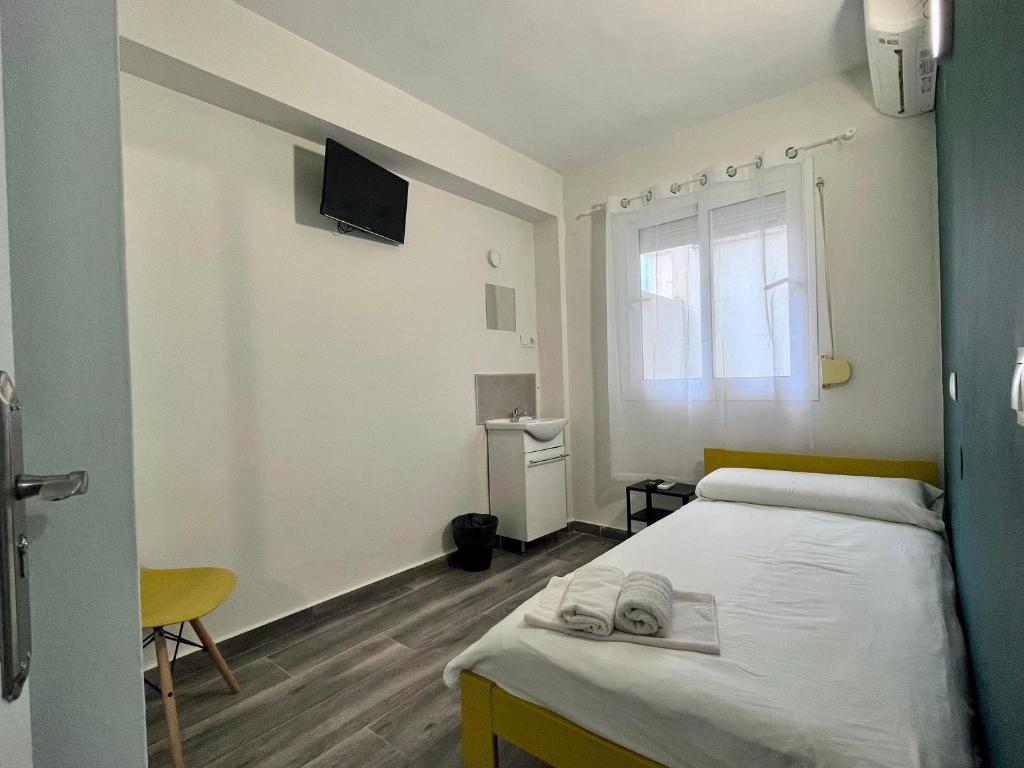 A bed or beds in a room at New Click & Room