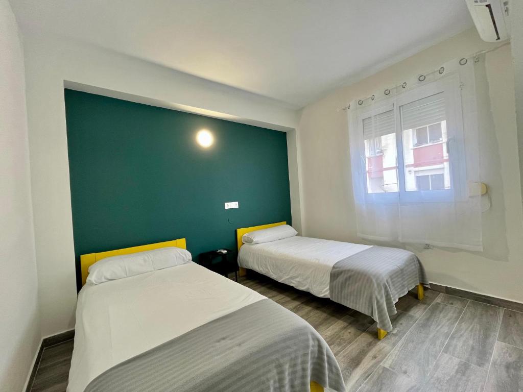 A bed or beds in a room at New Click & Room