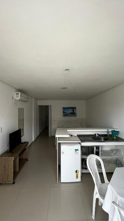 Uma TV ou centro de entretenimento em Pousada Pedras do Mariscal