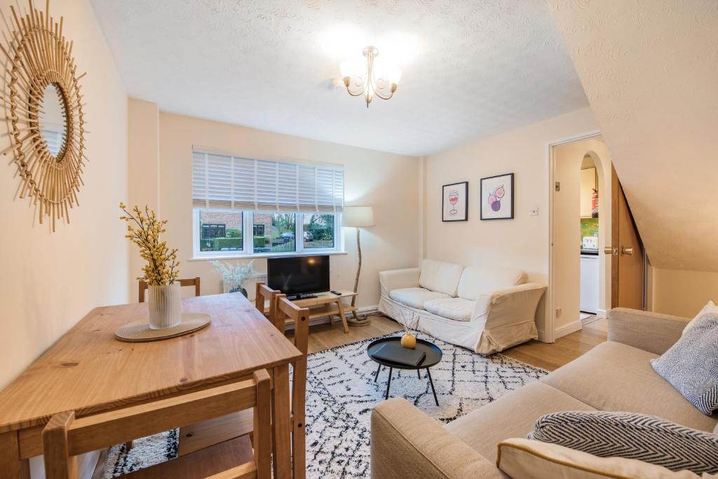 a living room with a couch and a table at Stylish Short Term Let - Bucks in Bourne End