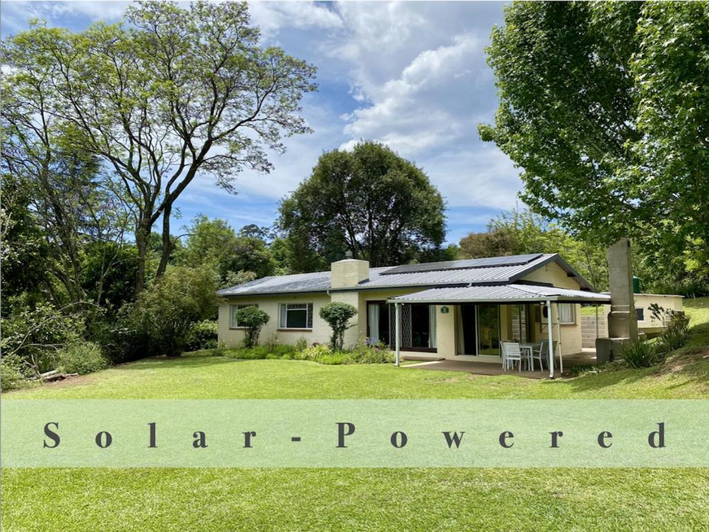 a house with a sign for southern powered at Berg Escape Bottlebrush - Spacious Luxury Family Home in Winterton