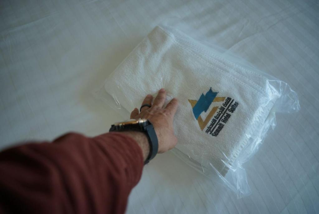 Postel nebo postele na pokoji v ubytování Summit Hotel Suites - القمة للأجنحة الفندقيه