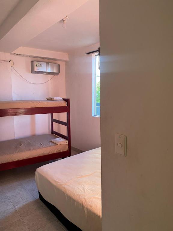 Postel nebo postele na pokoji v ubytování Posada Casamar2 alojamiento en San Andrés islas