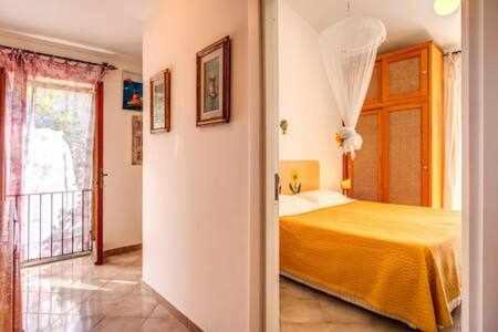 Posteľ alebo postele v izbe v ubytovaní GOCCE VILLAS - Sunshine Villa