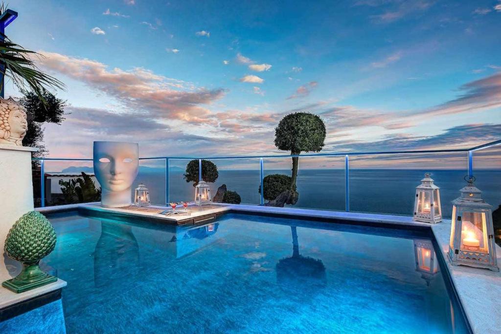a swimming pool with a view of the ocean at Villa Islamorada Pool and Sea View in Massa Lubrense