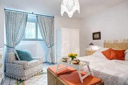 Łóżko lub łóżka w pokoju w obiekcie GOCCE VILLAS - Antica Limonaia