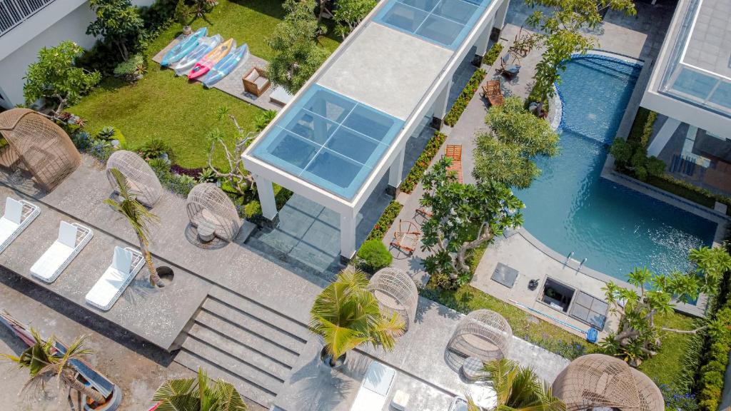 an overhead view of a house with a swimming pool at Tabebuya Resto & Resort in Kesembu