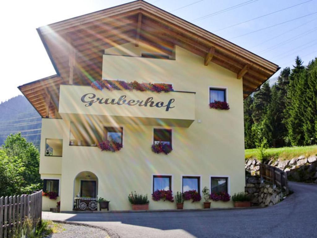 a building with a sign on the side of it at Apartment Gampen by Interhome in Obergand