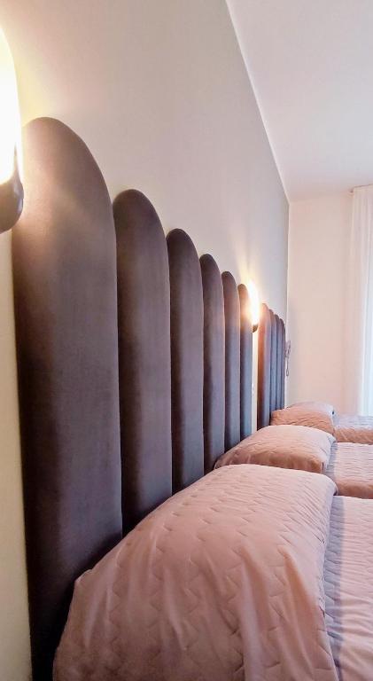 Posteľ alebo postele v izbe v ubytovaní Hotel Everest Arco