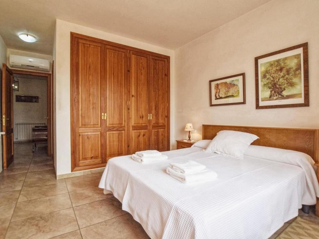 A bed or beds in a room at Holiday Home Pla De Ses Rotes by Interhome