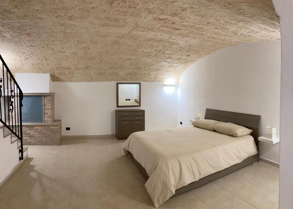 Tempat tidur dalam kamar di Dimora Castello