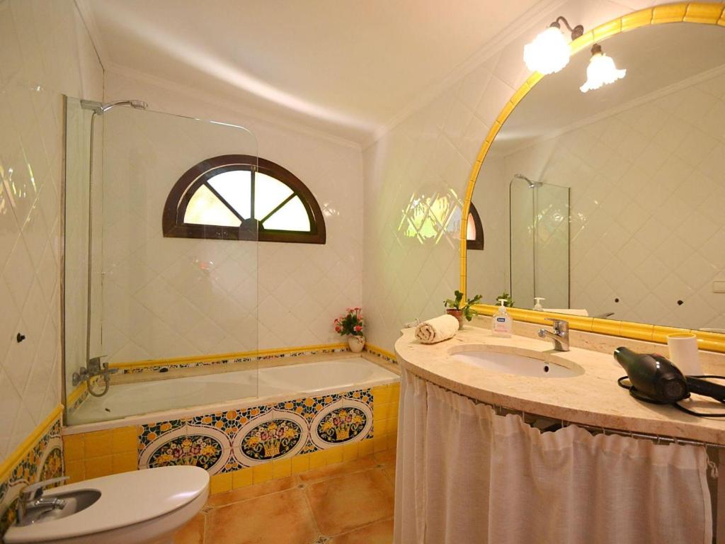 A bathroom at Holiday Home Roura by Interhome