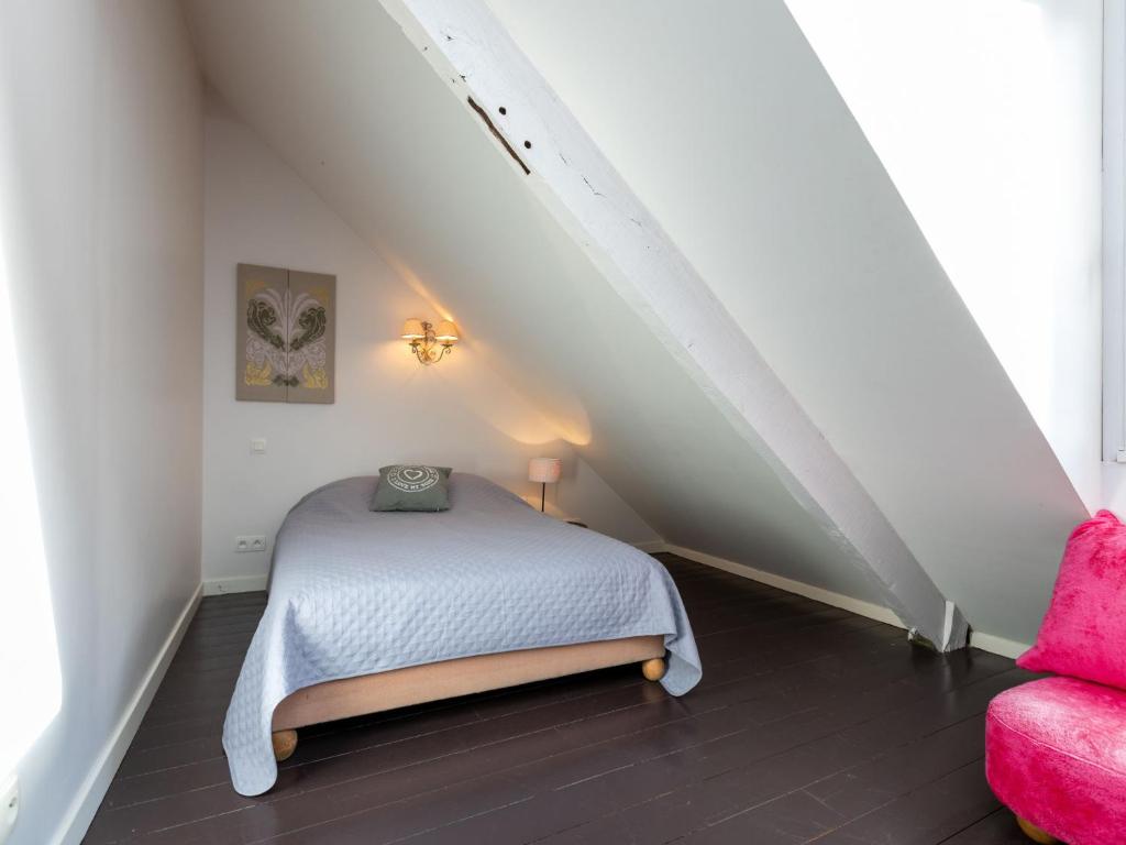 Un pat sau paturi &icirc;ntr-o camer&#x103; la Villa Scarlette by Interhome