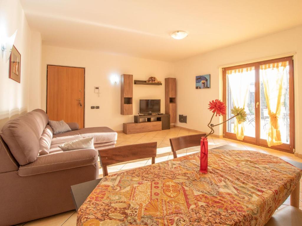 a living room with a couch and a table at Apartment Amendola by Interhome in Formia