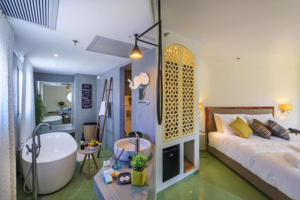 Postel nebo postele na pokoji v ubytování Margosa Boutique Hotel Tel-Aviv Jaffa