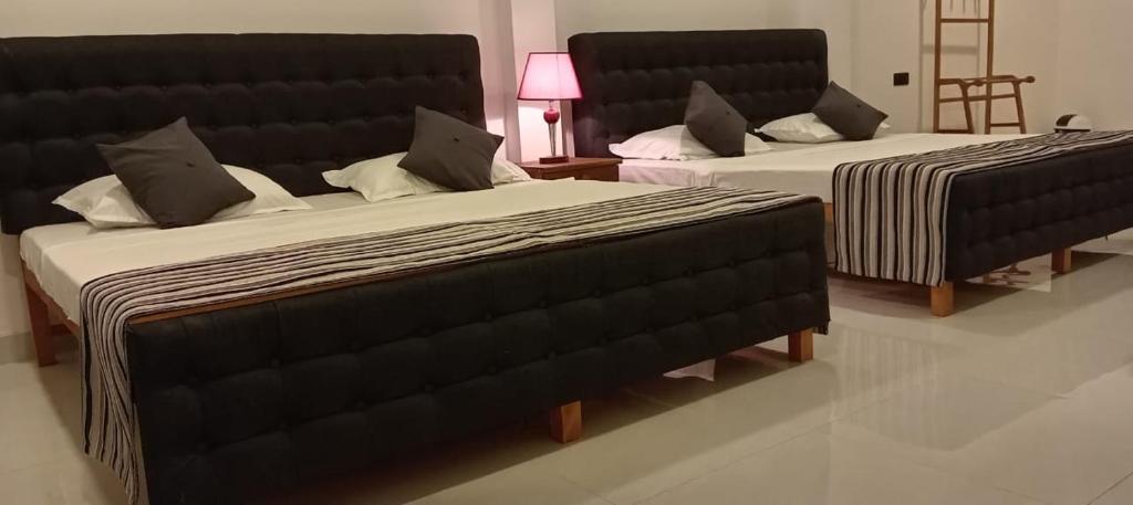 Voodi või voodid majutusasutuse Hotel Sapid Luck Yala Safari toas