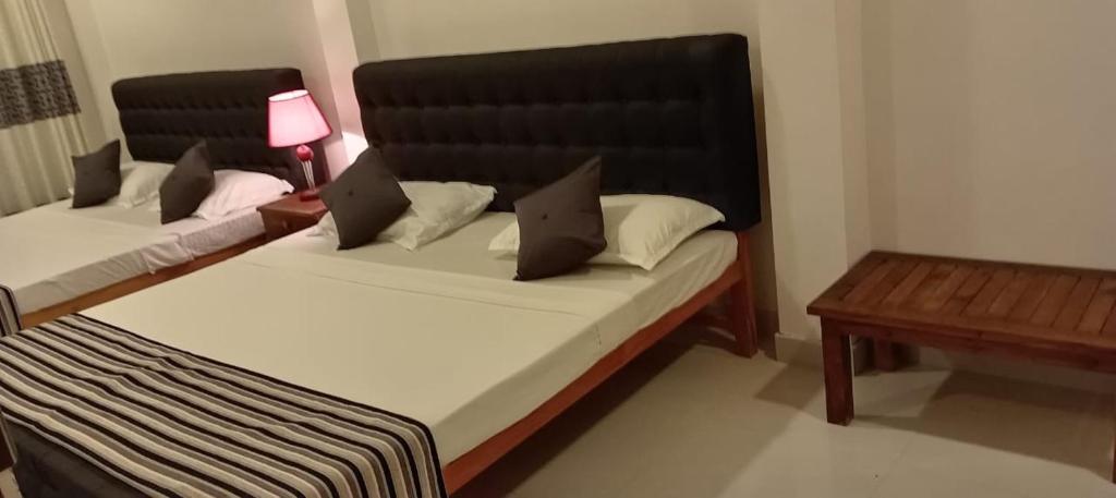 Voodi või voodid majutusasutuse Hotel Sapid Luck Yala Safari toas