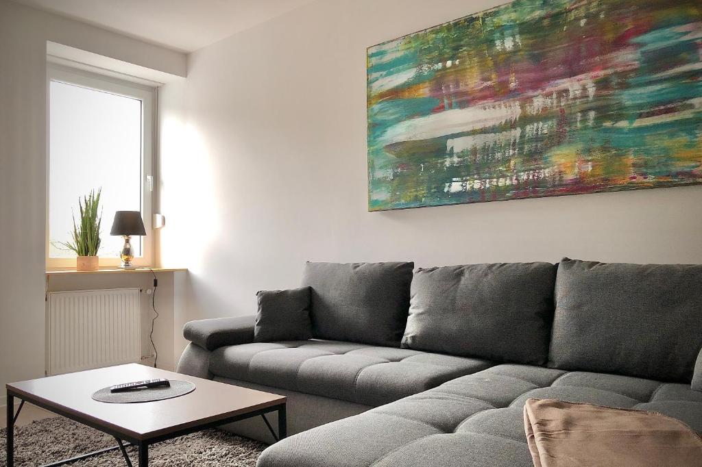 a living room with a couch and a table at Schneiders Ferienwohnung 1 in Braunshausen