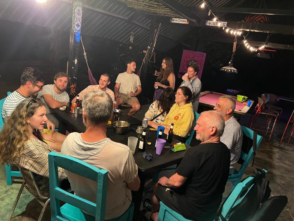 a group of people sitting at tables in a room at Hostal La Casa de Juan in Valle de Anton