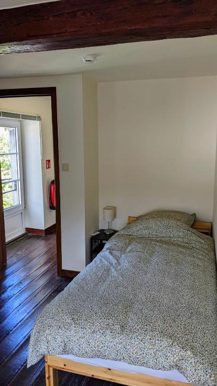 Postel nebo postele na pokoji v ubytování L'ARONDE