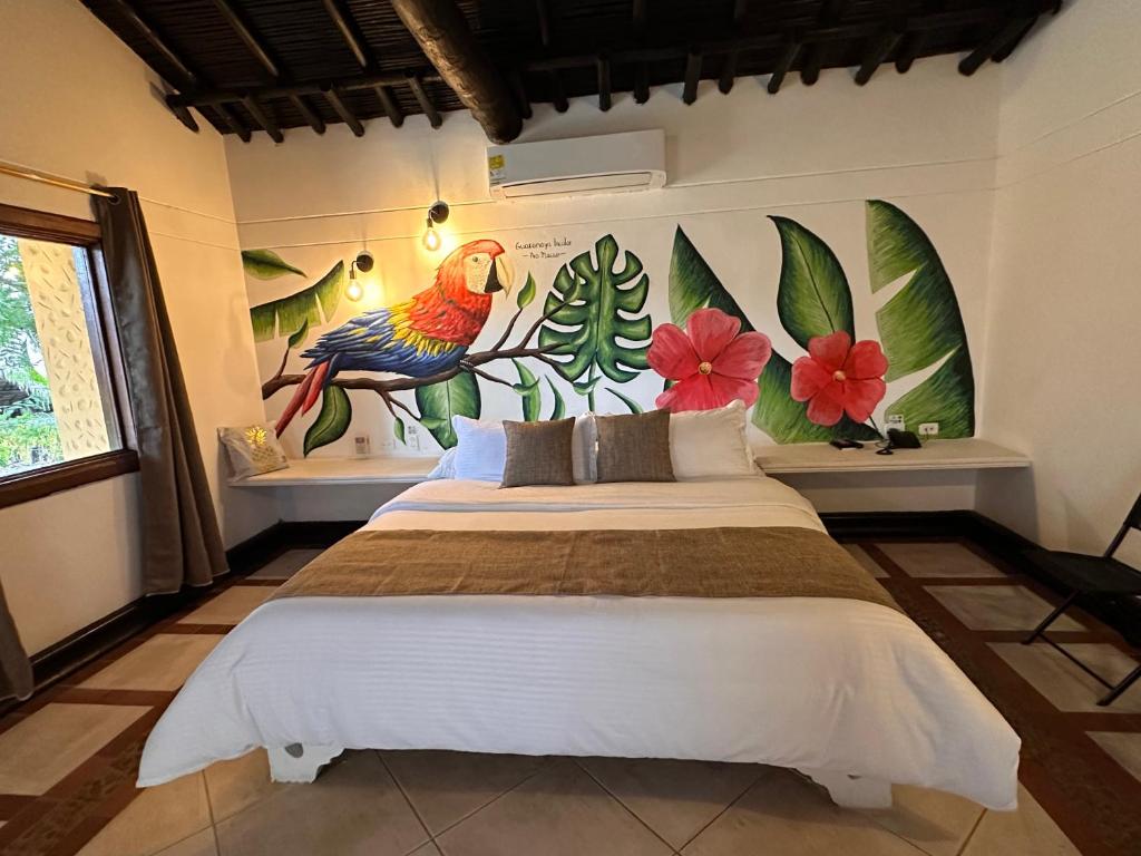 Postel nebo postele na pokoji v ubytování Hotel Portón del Sol