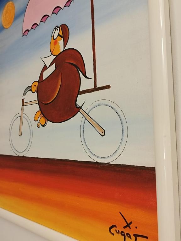 a painting of a bird riding a bike with an umbrella at El Cielo de Cebreros in Cebreros