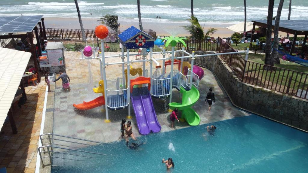 an indoor playground with a slide in the water at Vila do Mar Natal - All Inclusive in Natal