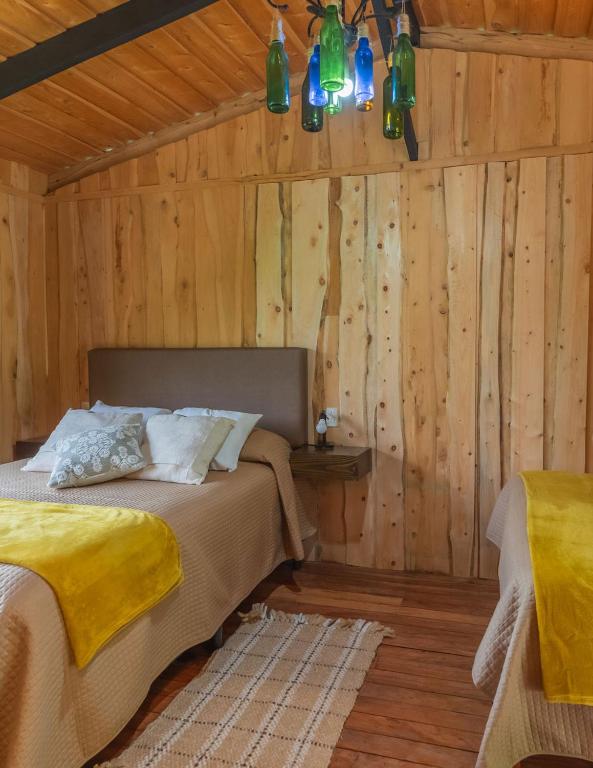 Postel nebo postele na pokoji v ubytování Cedrela Eco-Lodge & Restaurante