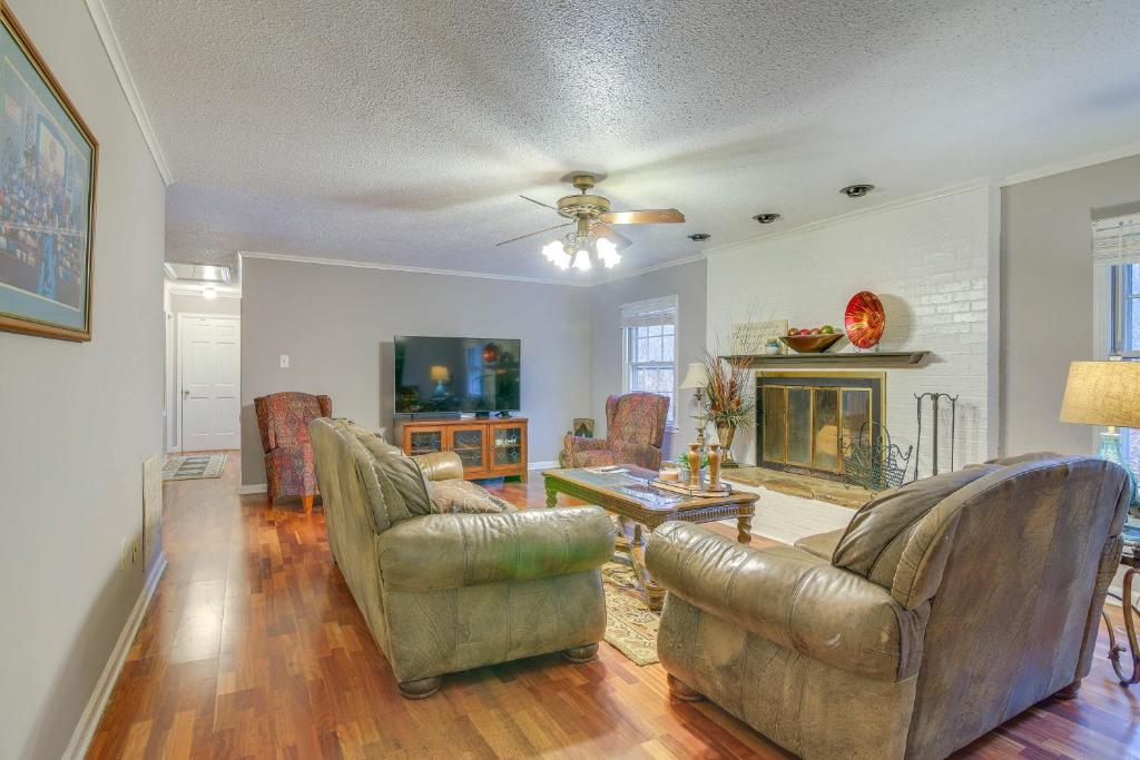 a living room with two couches and a fireplace at Charming Tennessee Retreat with Fireplace and Grill! in Jackson