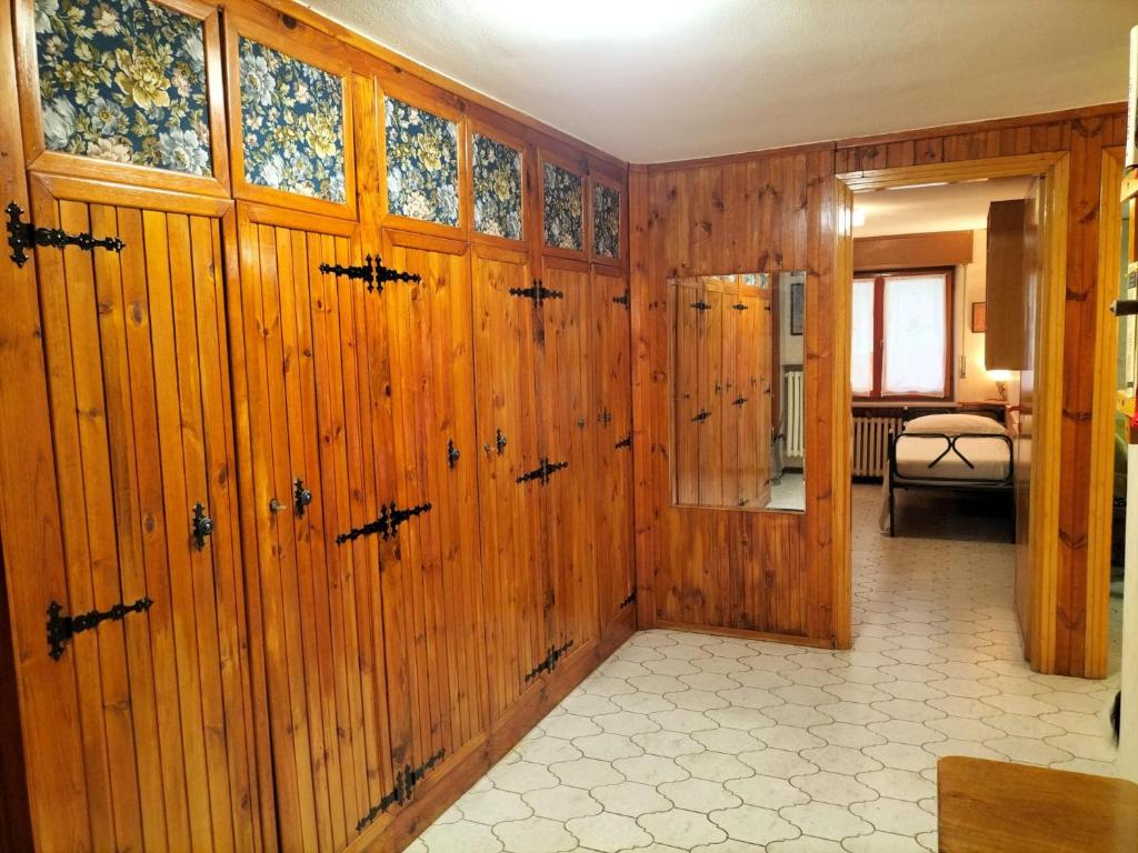 a room with wood paneled walls and a hallway at Casa di Lucy in Frabosa Soprana