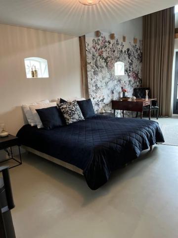 Ένα ή περισσότερα κρεβάτια σε δωμάτιο στο De Citadel - de Weide