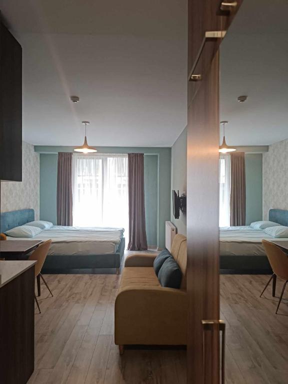 Postel nebo postele na pokoji v ubytování Новый Гудаури Loft 2