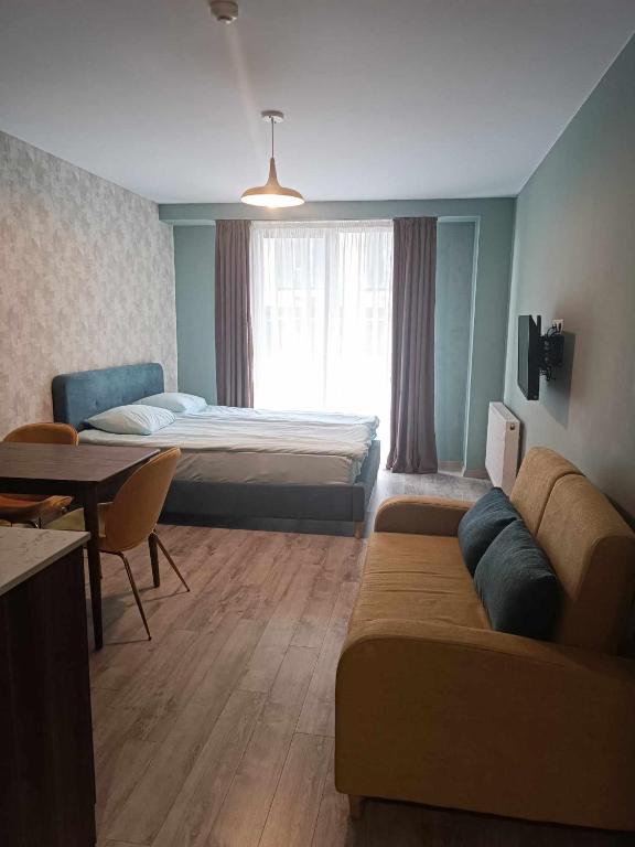 Postel nebo postele na pokoji v ubytování Новый Гудаури Loft 2