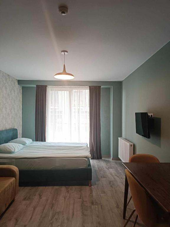 Postel nebo postele na pokoji v ubytování Новый Гудаури Loft 2