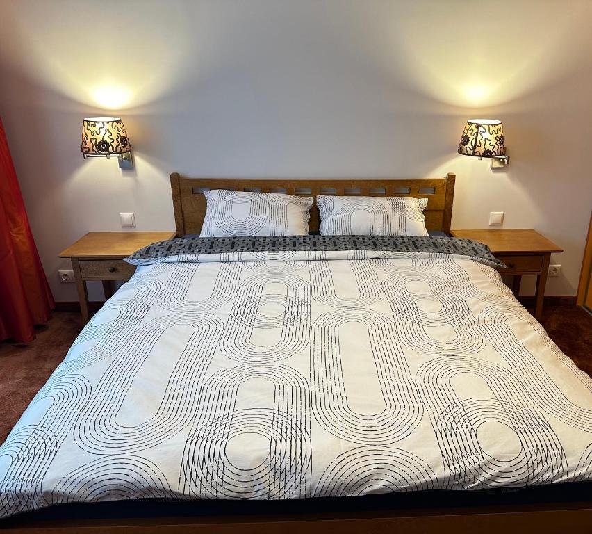 Ένα ή περισσότερα κρεβάτια σε δωμάτιο στο Aparamentai šeimai, poilsiui ar darbui