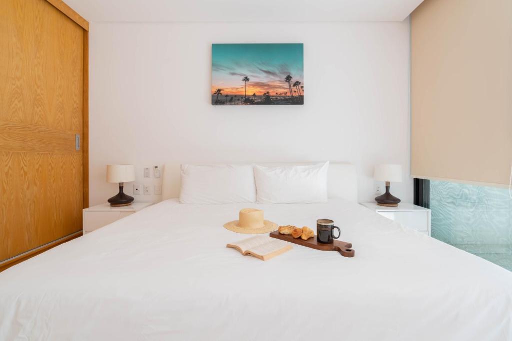 Postel nebo postele na pokoji v ubytování Infinity Suites