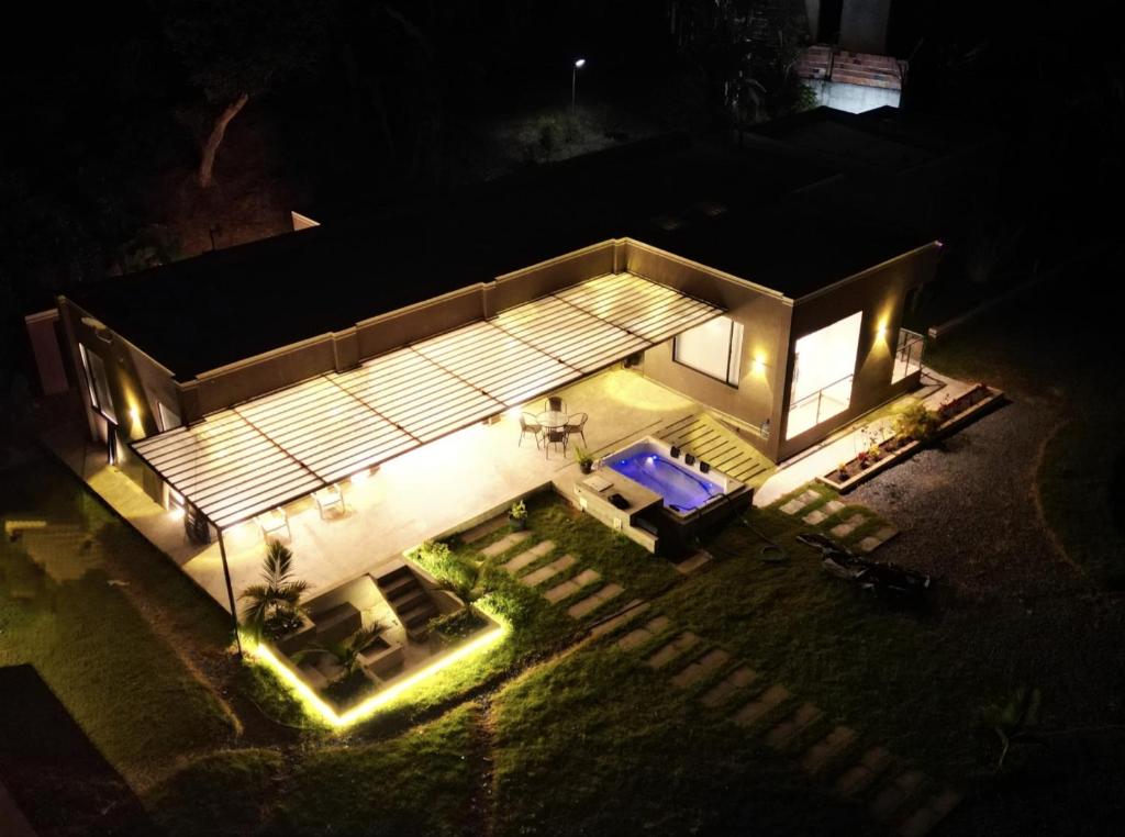an overhead view of a house at night with lights at Finca terraviva in Moniquirá