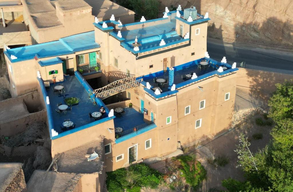an overhead view of a castle with blue roof at Labyrinth Kasbah Dades in Aït Ben Ali