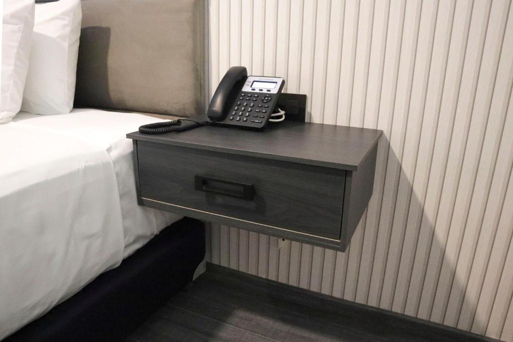 Postel nebo postele na pokoji v ubytování HUNICO HOTEL
