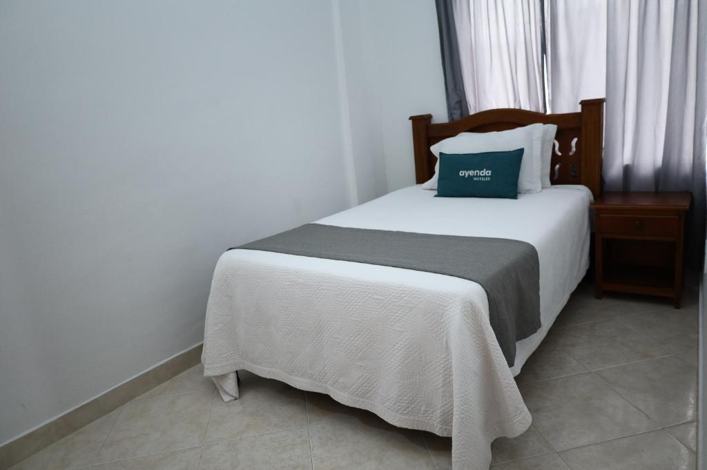 Postel nebo postele na pokoji v ubytování Ayenda Torre 2