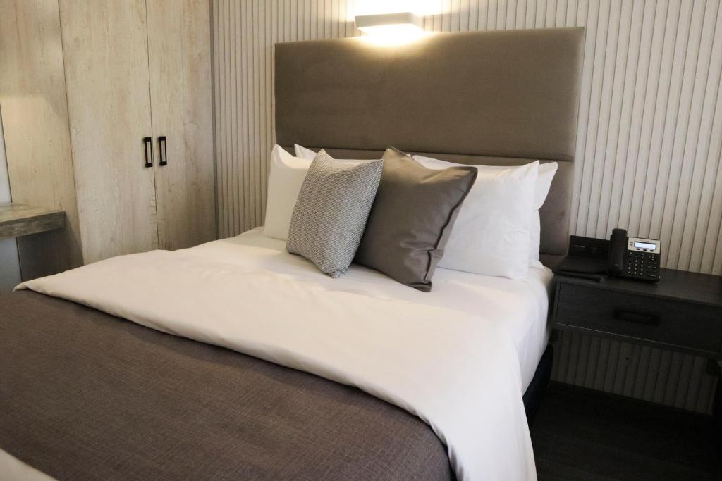 Postel nebo postele na pokoji v ubytování HUNICO HOTEL