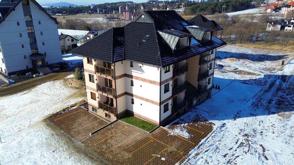 an aerial view of a house in the snow at Vila Eden Lux in Zlatibor