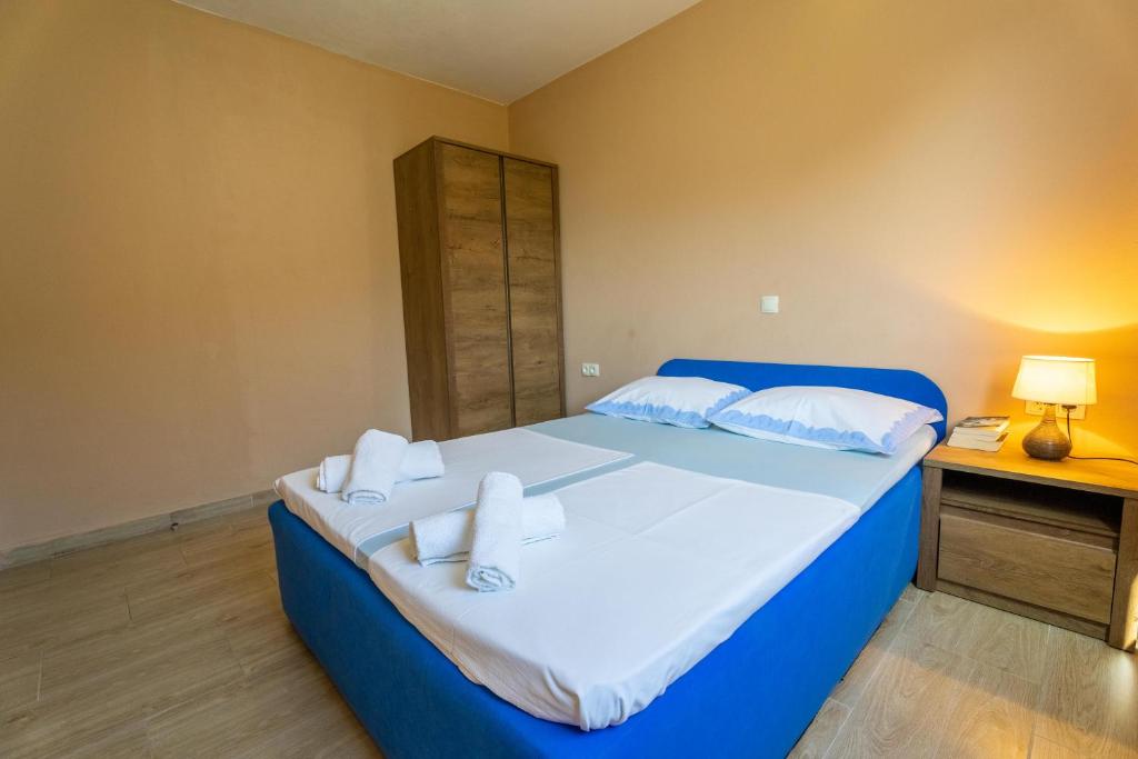 Postel nebo postele na pokoji v ubytování Apartmani Malbašić